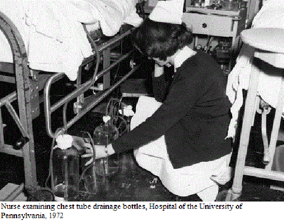 Nurse examining chest tube drainage bottles, HUP, 1972